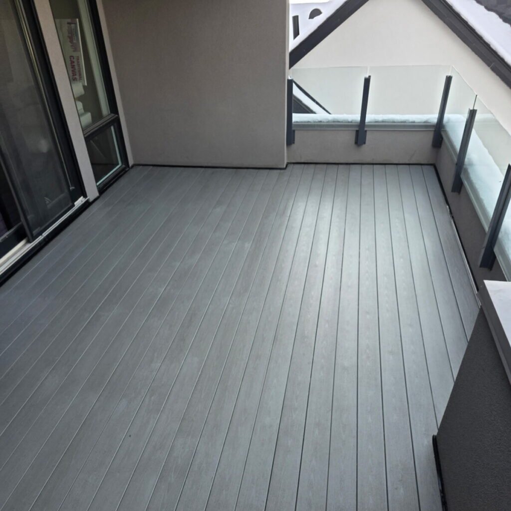 Finished balcony deck with grey waterproof membrane